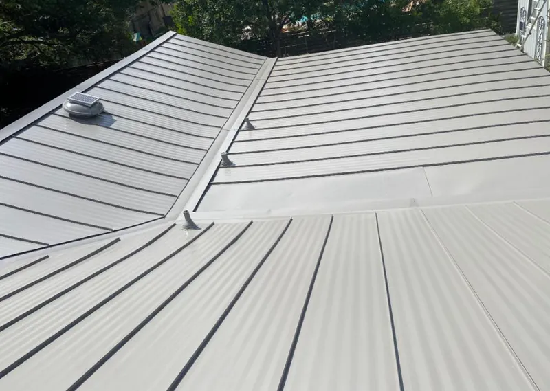 Solar attic fan installed on a metal roof for Roof Ventilation in Rowlett
